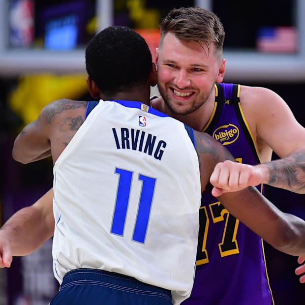 Los Angeles Lakers guard Luka Doncic (77) reacts with Dallas Mavericks guard Kyrie Irving