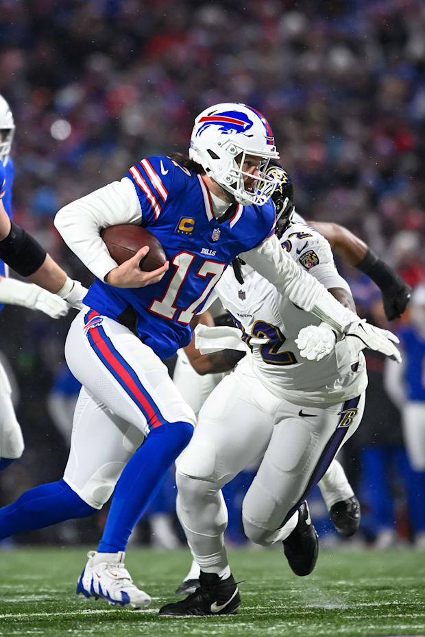 Buffalo Bills quarterback Josh Allen runs the ball against the Baltimore Ravens.