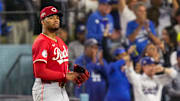 Cincinnati Reds starting pitcher Hunter Greene (21) reacts as Los Angeles Dodgers right fielder Teoscar Hernandez (37) runs the bases on a three-run home run in the third inning of the MLB National League Wild Card Game 1 between the Los Angeles Dodgers and the Cincinnati Reds at Dodger Stadium in Los Angeles on Tuesday, Sept. 30, 2025. The Dodgers won game 1 of the series, 10-5.