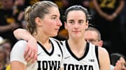Mar 3, 2024; Iowa City, Iowa, USA; Iowa Hawkeyes guard Caitlin Clark (22) reacts with guard Kate Martin (20) during senior day after the game against the Ohio State Buckeyes.  Clark broke the NCAA basketball all-time scoring record during the second quarter. Mandatory Credit: Jeffrey Becker-Imagn Images
