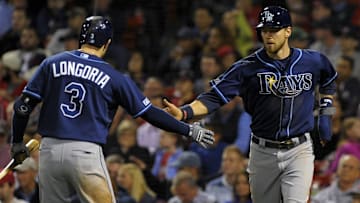Sep 23, 2014; Boston, MA, USA; Tampa Bay Rays third baseman Evan Longoria (3) congratulates second baseman Ben Zobrist (18) after scoring a run during the eighth inning against the Boston Red Sox at Fenway Park. Mandatory Credit: Bob DeChiara-Imagn Images