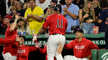 Sep 14, 2023; Boston, Massachusetts, USA; Boston Red Sox designated hitter Rafael Devers (11) celebrates his home run against the New York Yankees with manager Alex Cora (13) during the third inning at Fenway Park. Mandatory Credit: Eric Canha-Imagn Images