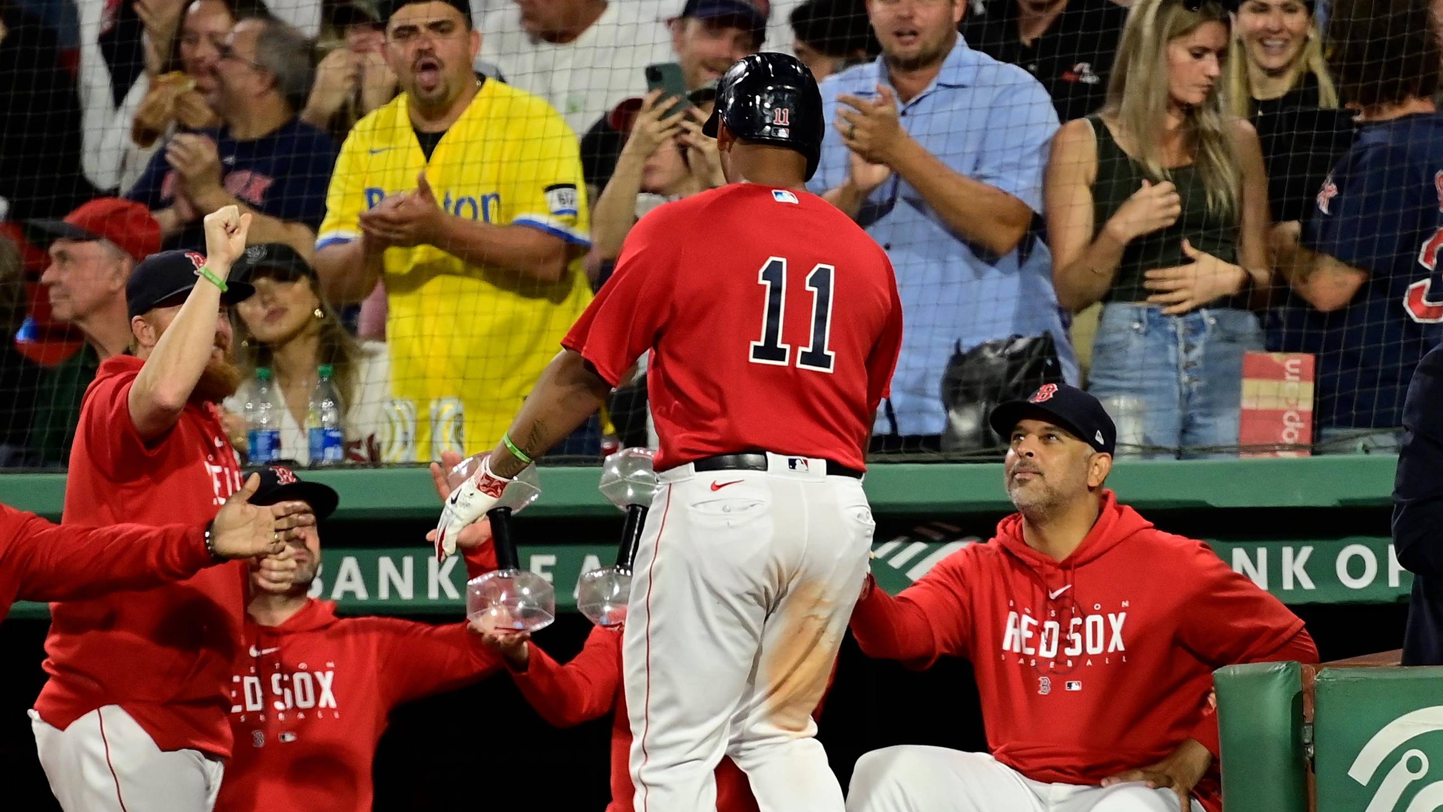 Sep 14, 2023; Boston, Massachusetts, USA; Boston Red Sox designated hitter Rafael Devers (11) celebrates his home run against the New York Yankees with manager Alex Cora (13) during the third inning at Fenway Park. Mandatory Credit: Eric Canha-Imagn Images
