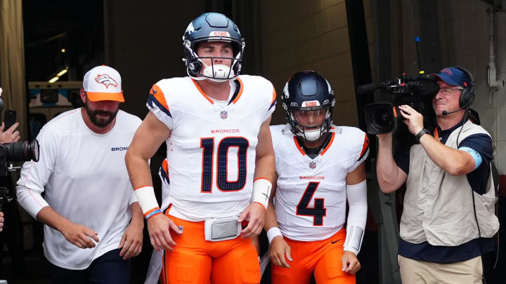 Aug 18, 2024; Denver, Colorado, USA; Denver Broncos quarterback Bo Nix (10) and quarterback Zach Wilson (4) before the preseason game against the Green Bay Packers at Empower Field at Mile High. 