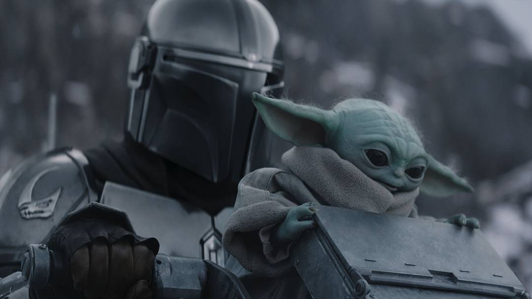 (L-R) The Mandalorian and Grogu in Lucasfilm's THE MANDALORIAN AND GROGU. Photo courtesy of Lucasfilm. © 2026 Lucasfilm Ltd™. All Rights Reserved.