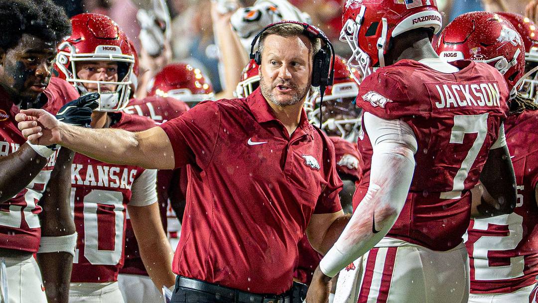 Arkansas Razorbacks coach Ryan Silverfield (left) talks to his quarterback KJ Jackson (right) during first half against Tulsa. Arkansas Razorbacks coach Ryan Silverfield (left) talks to his quarterback KJ Jackson (right) during first half against Tulsa.