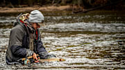 Max Werkman releasing a steelhead he swung up from a deep hole at the end of a run.  