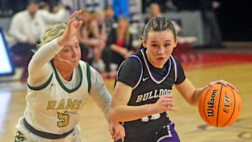 Susan Moore  s Lani Smallwood drives to the basket as Sylvania  s Molly Weaver defends during high school basketball action in Jacksonville, Alabama February 17, 2024. (Dave Hyatt: The Gadsden Times)