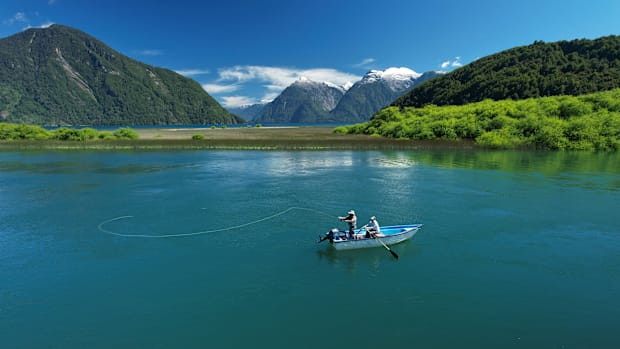 A lake in the Chilean Patagonia's where an angler is fly fishing for big brown trout.  