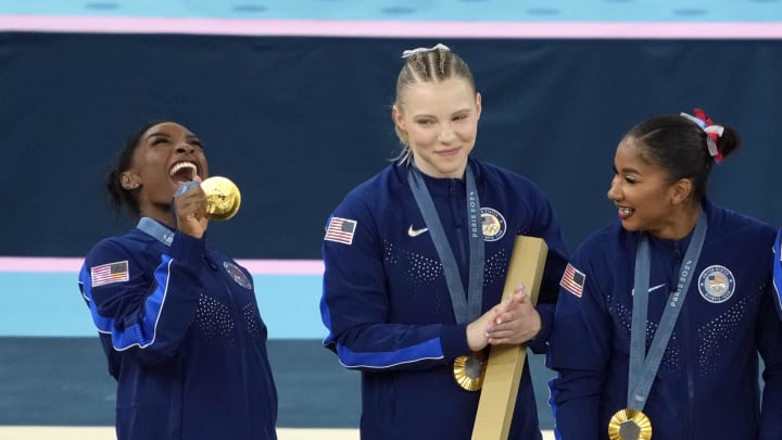 Jul 30, 2024; Paris, France; Simone Biles of the United States celebrates with her gold medal after the women’s team final at the Paris 2024 Olympic Summer Games at Bercy Arena.