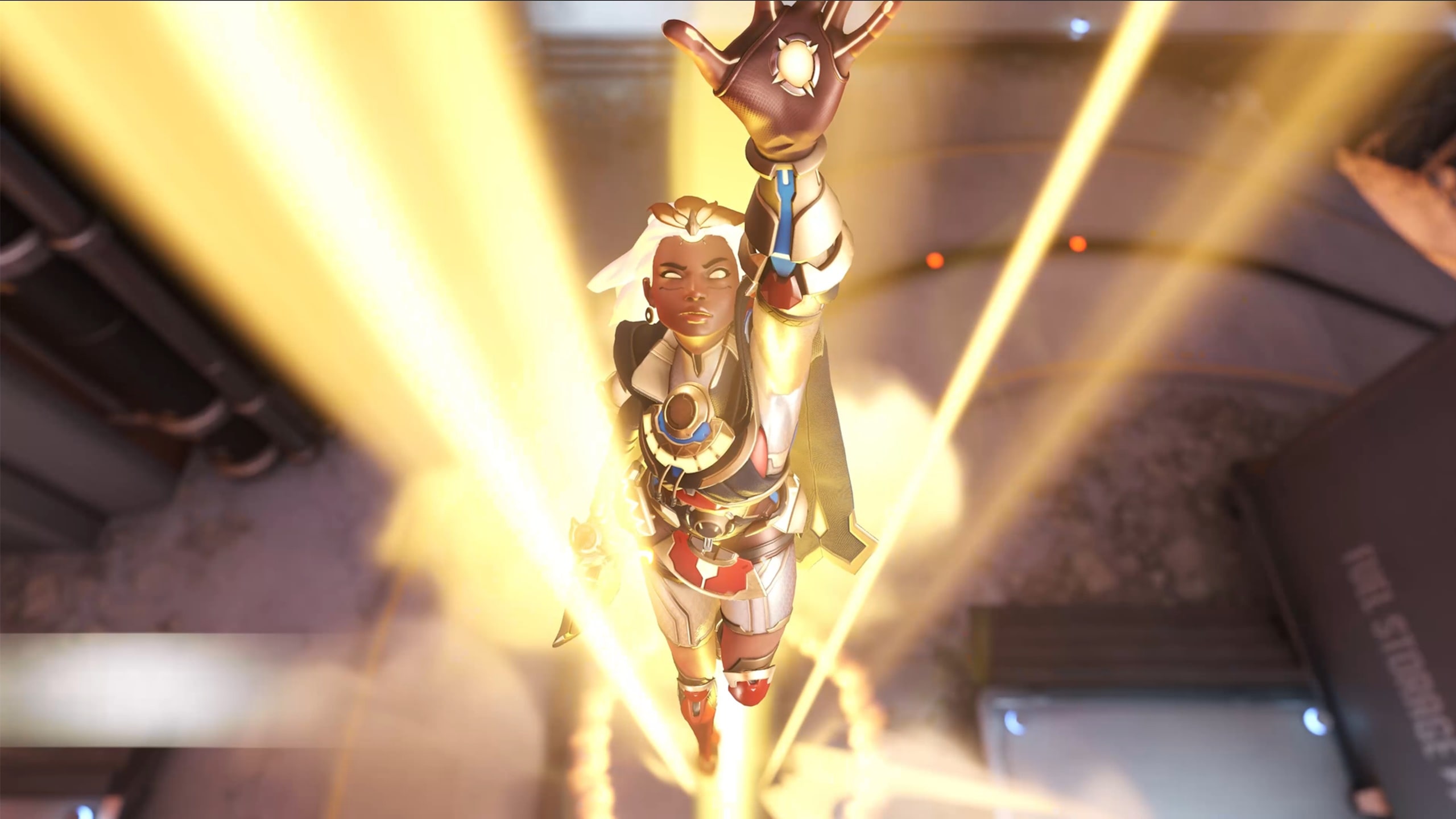 Overwatch 2's Illari, reaching for the sun as she casts her ultimate
