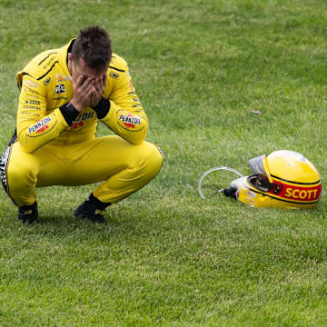 Scott McLaughlin reacts after crashing on the pace lap of the Indy 500.