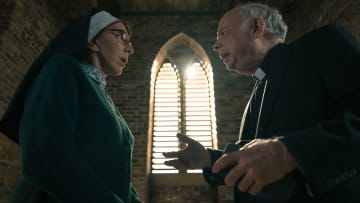 L-R Andrea Martin as Sister Andrea and Wallace Shawn as Father Ignatious appearing in Evil episode 9, season 4, streaming on Paramount+, 2023. Photo Credit: Elizabeth Fisher/Paramount+