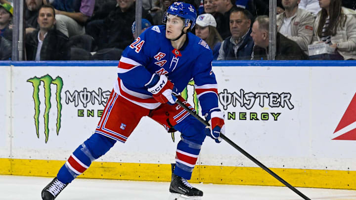 Mar 10, 2026; New York, New York, USA;  New York Rangers left wing Tye Kartye (24) plays the puck against the Calgary Flames during the first period at Madison Square Garden. Mandatory Credit: Dennis Schneidler-Imagn Images