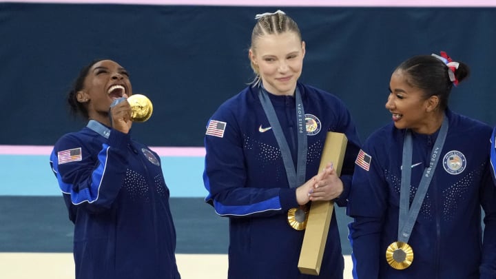 Simone Biles of the United States celebrates with her gold medal after the women’s team final at the Paris 2024 Olympic Summer Games at Bercy Arena. 