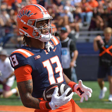 Sep 14, 2024; Champaign, Illinois, USA;  Illinois Fighting Illini wide receiver Pat Bryant (13) scores a touchdown against the Central Michigan Chippewas during the first half at Memorial Stadium. Mandatory Credit: Ron Johnson-Imagn Images