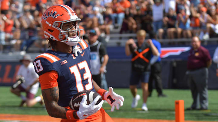 Sep 14, 2024; Champaign, Illinois, USA;  Illinois Fighting Illini wide receiver Pat Bryant (13) scores a touchdown against the Central Michigan Chippewas during the first half at Memorial Stadium. Mandatory Credit: Ron Johnson-Imagn Images