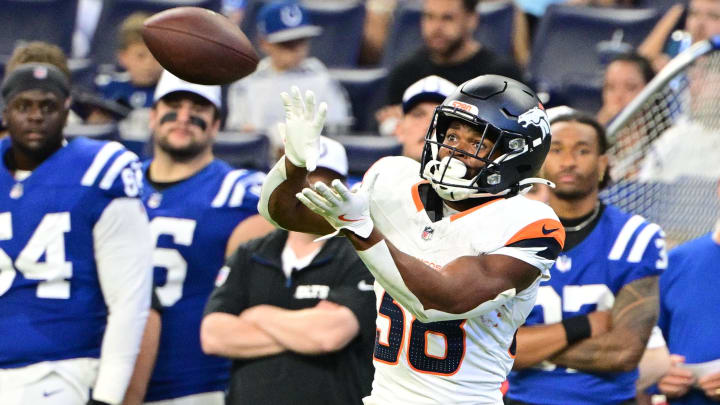 Aug 11, 2024; Indianapolis, Indiana, USA; Denver Broncos running back Jaleel McLaughlin (38) catches a pass during the second half against the Indianapolis Colts at Lucas Oil Stadium. 