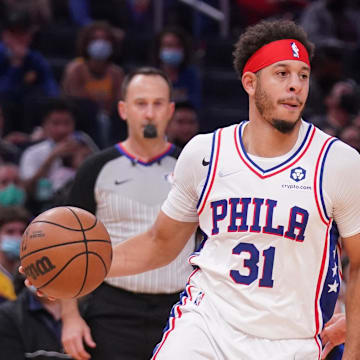 Nov 24, 2021; San Francisco, California, USA; Philadelphia 76ers guard Seth Curry (31) dribbles the ball next to Golden State Warriors guard Stephen Curry (30) in the second quarter at the Chase Center. Mandatory Credit: Cary Edmondson-Imagn Images