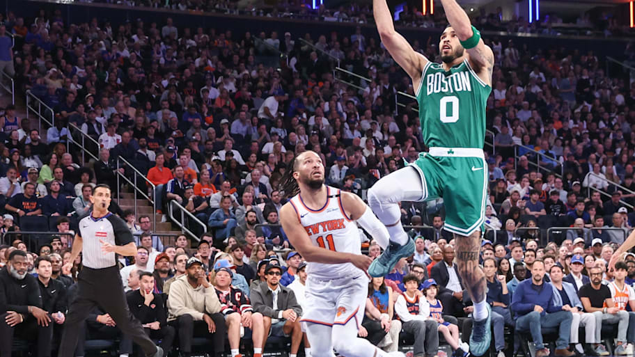 Boston Celtics forward Jayson Tatum drives past New York Knicks guard Jalen Brunson.