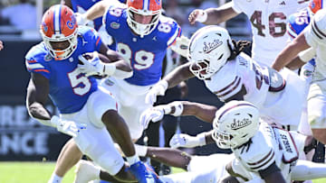 Sep 21, 2024; Starkville, Mississippi, USA; Florida Gators running back Treyaun Webb (5) runs the ball against the Mississippi State Bulldogs during the second quarter at Davis Wade Stadium at Scott Field. Mandatory Credit: Matt Bush-Imagn Images