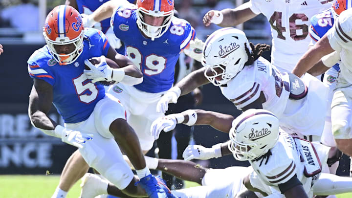 Sep 21, 2024; Starkville, Mississippi, USA; Florida Gators running back Treyaun Webb (5) runs the ball against the Mississippi State Bulldogs during the second quarter at Davis Wade Stadium at Scott Field. Mandatory Credit: Matt Bush-Imagn Images
