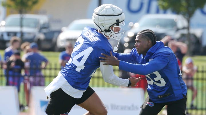 Bills defensive backs Cole Bishop, left, and Te'Cory Couch get in extra work on coverage before the start of day three of training camp.