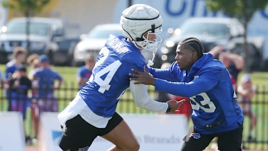 Bills defensive backs Cole Bishop, left, and Te'Cory Couch get in extra work on coverage before the start of day three of training camp.