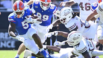 Sep 21, 2024; Starkville, Mississippi, USA; Florida Gators running back Treyaun Webb (5) runs the ball against the Mississippi State Bulldogs during the second quarter at Davis Wade Stadium at Scott Field. Mandatory Credit: Matt Bush-Imagn Images