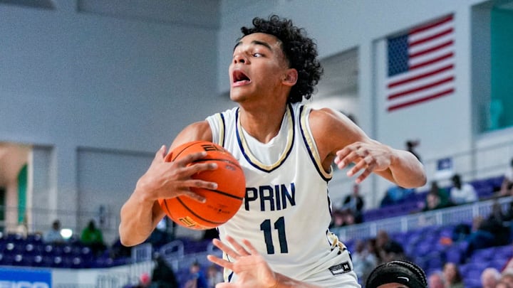 Principia Panthers guard Quentin Coleman (11) is fouled by Wheeler Wildcats guard Kevin Savage III (2) during the fourth quarter of a City of Palms Classic quarterfinal game at Suncoast Credit Union Arena in Fort Myers, Fla., on Saturday, Dec. 20, 2025.