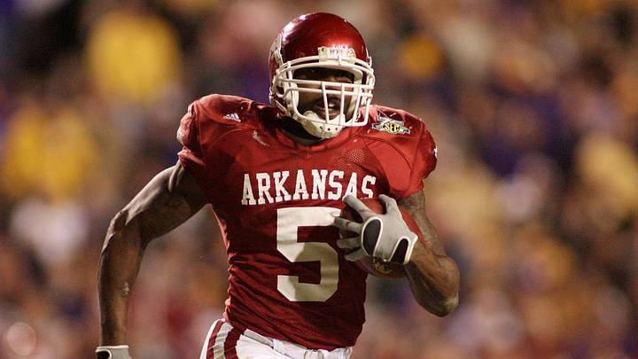 Nov. 23, 2007; Baton Rouge, LA, USA; Arkansas Razorbacks tailback Darren McFadden (5) carries against the LSU Tigers in overtime at Tiger Stadium. The Arkansas Razorbacks defeated the Tigers 50-48 in triple overtime. Mandatory Credit: John David Mercer-Imagn Images Copyright © 2007 John David Mercer