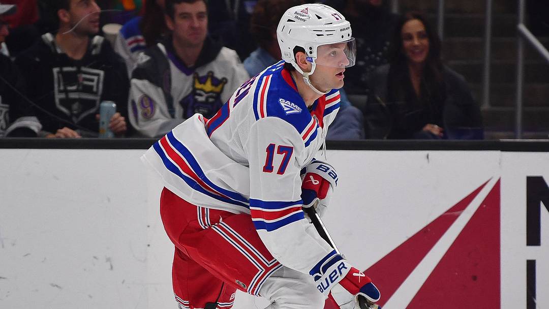 Jan 20, 2026; Los Angeles, California, USA; New York Rangers defenseman Will Borgen (17) moves the puck against the Los Angeles Kings during the second period at Crypto.com Arena.
