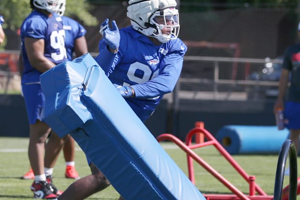 Bills rookie tackle Deone Walker throws aside a blocking sled during the opening day of Buffalo Bills training camp.