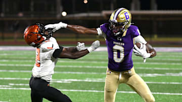 Booker's defensive back/wide receiver Chauncey Kennon (#0) puts the stiff arm to Lely's wide receiver, Dwayne Liberal (#12). The Booker Tornadoes hosted the Lely Trojans (Naples, FL) Friday night, Aug. 23, 2024, who lost to Booker 46-0 during the first regular non-conference season game of the year.