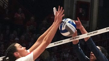 Penn State graduate student setter Seleisa Elisaia (5) pushes the ball over to Wisconsin's side in the third set during the 2022 NCAA volleyball tournament.