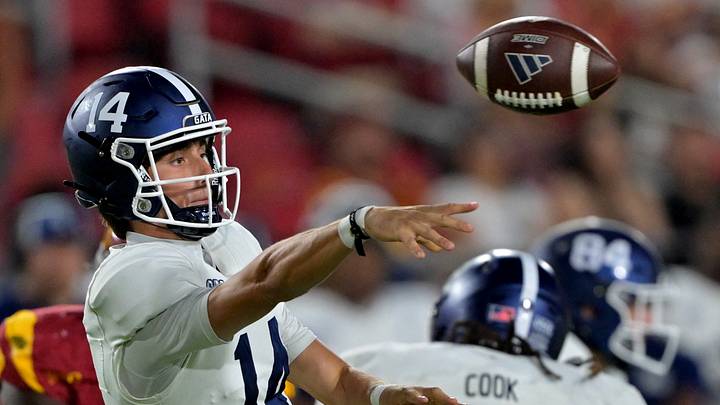 Sep 6, 2025; Los Angeles, California, USA; Georgia Southern Eagles quarterback Turner Helton (14) throws a pass in the second half against the USC Trojans at United Airlines Field at the Los Angeles Memorial Coliseum. Mandatory Credit: Jayne Kamin-Oncea-Imagn Images