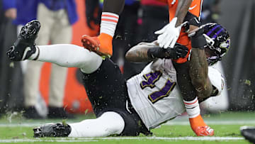 Cleveland Browns wide receiver Malachi Corley (83) tries to shed Baltimore Ravens defensive end Dre'Mont Jones (41) during the first half of NFL football game at Huntington Bank Field, Nov. 16, 2025, in Cleveland, Ohio.