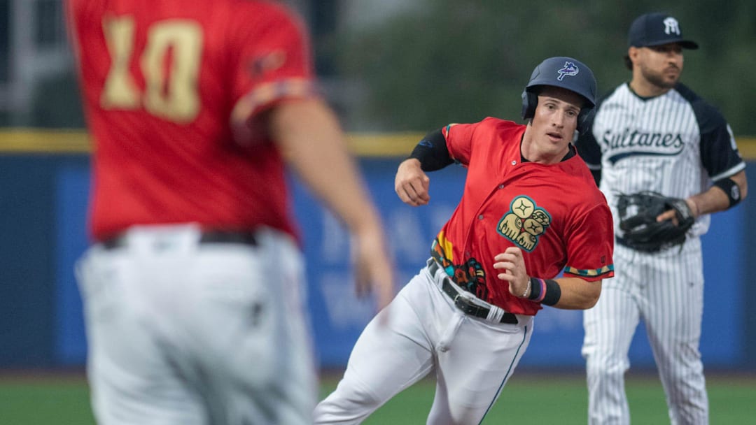 Jacob Berry (4) is held at third base during the Monterrey Sultanes vs Pensacola Blue Wahoos (wearing Pok-Ta-Pok uniforms) exhibition baseball game at Blue Wahoos Stadium in Pensacola on Tuesday, April, 2, 2024. Pok-Ta-Pok was a Mesoamerican game played in the 16th century.