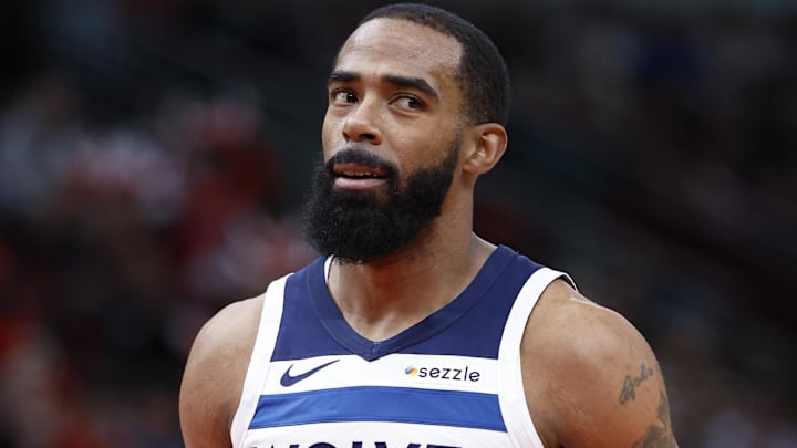 Nov 7, 2024; Chicago, Illinois, USA; Minnesota Timberwolves guard Mike Conley (10) reacts after shooting a free throw against the Chicago Bulls during the first half at United Center. Mandatory Credit: Kamil Krzaczynski-Imagn Images