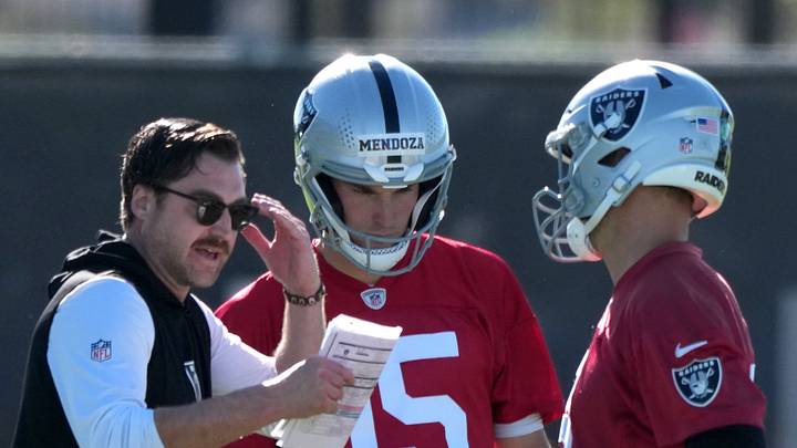 Las Vegas Raiders offensive coordinator Andrew Janocko (left) talks with quarterbacks Fernando Mendoza (15) and Kirk Cousins (8) during minicamp at Intermountain Health Performance Center.