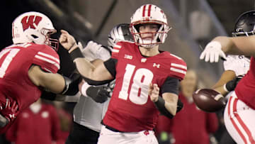 Wisconsin quarterback Braedyn Locke (18) fumbles the ball during the first quarter of their game against Oregon Saturday, November 16, 2024 at Camp Randall Stadium in Madison, Wisconsin. Wisconsin recovered the ball.