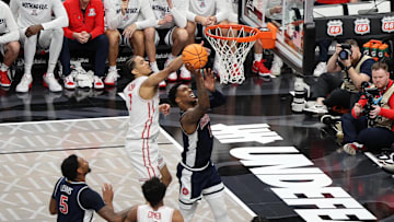 Mar 15, 2025; Kansas City, MO, USA; Arizona Wildcats guard Caleb Love (1) shoots the ball over Houston Cougars guard Milos Uzan (7) during the second half for the Big 12 Conference Tournament Championship game at T-Mobile Center. Mandatory Credit: William Purnell-Imagn Images