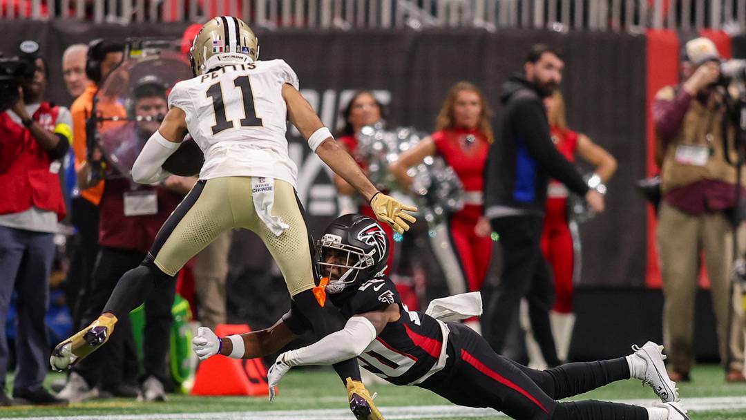 Jan 4, 2026; Atlanta, Georgia, USA; Atlanta Falcons cornerback Dee Alford (20) tackles New Orleans Saints wide receiver Dante Pettis (11) in the first quarter at Mercedes-Benz Stadium.