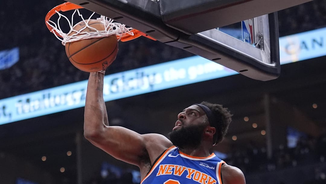 Mar 3, 2026; Toronto, Ontario, CAN; New York Knicks center Mitchell Robinson (23) shoots against the Toronto Raptors during the first half at Scotiabank Arena. Mandatory Credit: John E. Sokolowski-Imagn Images Mar 3, 2026; Toronto, Ontario, CAN; New York Knicks center Mitchell Robinson (23) shoots against the Toronto Raptors during the first half at Scotiabank Arena. Mandatory Credit: John E. Sokolowski-Imagn Images
