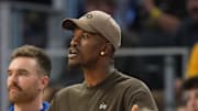 Apr 26, 2025; San Francisco, California, USA; Golden State Warriors forward Jimmy Butler III (center) yells from the bench against the Houston Rockets during the third quarter of game three of first round for the 2024 NBA Playoffs at Chase Center. Mandatory Credit: Darren Yamashita-Imagn Images