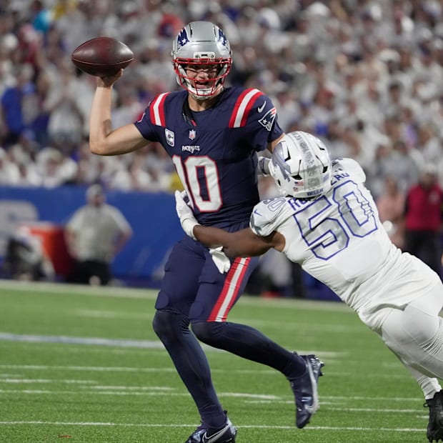 Patriots quarterback Drake Maye feels the pressure from Bills defensive end Greg Rousseau in Week 5.