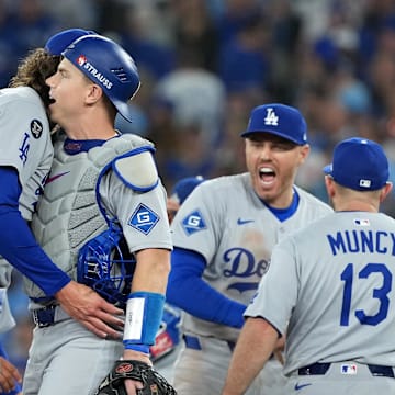 Oct 31, 2025; Toronto, Ontario, CAN; Los Angeles Dodgers pitcher Tyler Glasnow (31) reacts with catcher Will Smith (16) after the ninth inning for game six of the 2025 MLB World Series at Rogers Centre. Mandatory Credit: Nick Turchiaro-Imagn Images