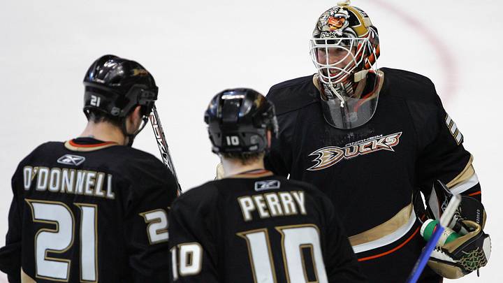 January 9, 2008; Anaheim CA, USA; Anaheim Ducks goalie Jean-Sebastien Giguere (35), defenseman Sean O'Donnell (21), and right wing Corey Perry (10) celebrate after the Ducks win 5-0 against the Toronto Maple Leafs at the Honda Center in Anaheim CA. Mandatory Credit: Gary A. Vasquez-USA TODAY Sports