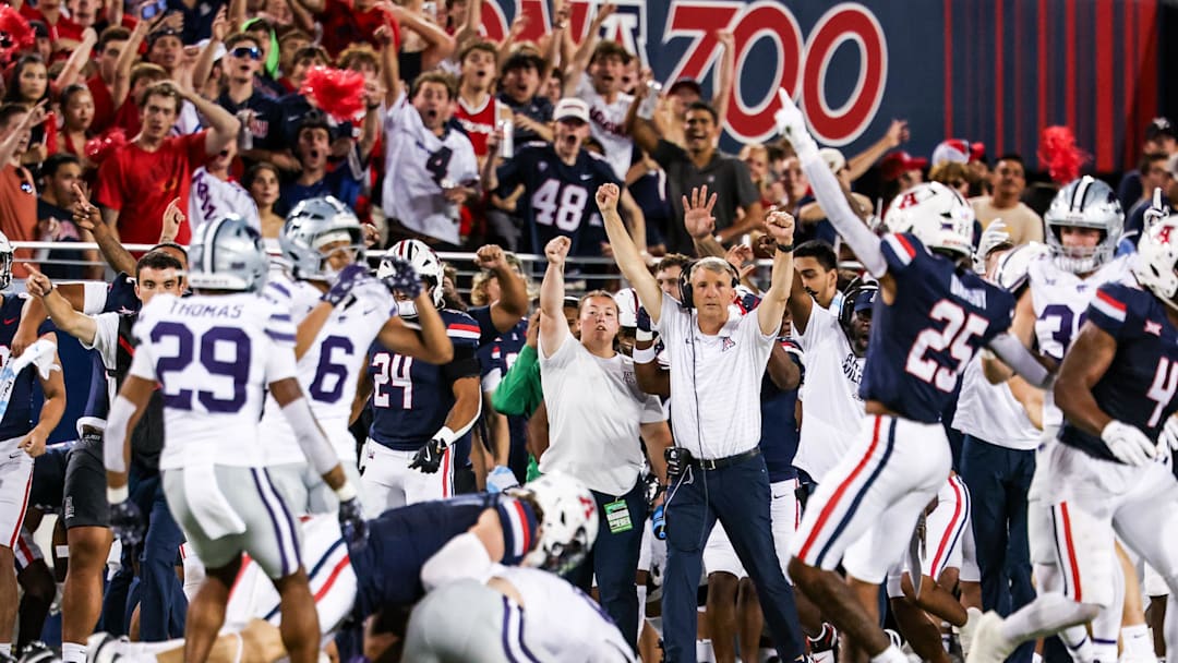 Sep 12, 2025; Tucson, Arizona, USA; Arizona Wildcats head coach Brent Brennan celebrates as defensive back Dalton Johnson (43) recovers the ball during the second quarter of the game against the Kansas State Wildcats at Arizona Stadium. Mandatory Credit: Aryanna Frank-Imagn Images