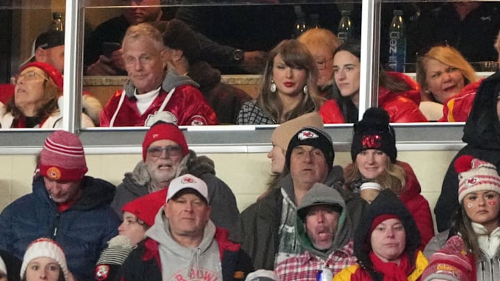 Recording artist Taylor Swift (upper middle) sits with Indiana Fever guard Caitlin Clark (upper right) during the fourth quarter of a 2025 AFC divisional round game between the Kansas City Chiefs and the Houston Texans at GEHA Field at Arrowhead Stadium.